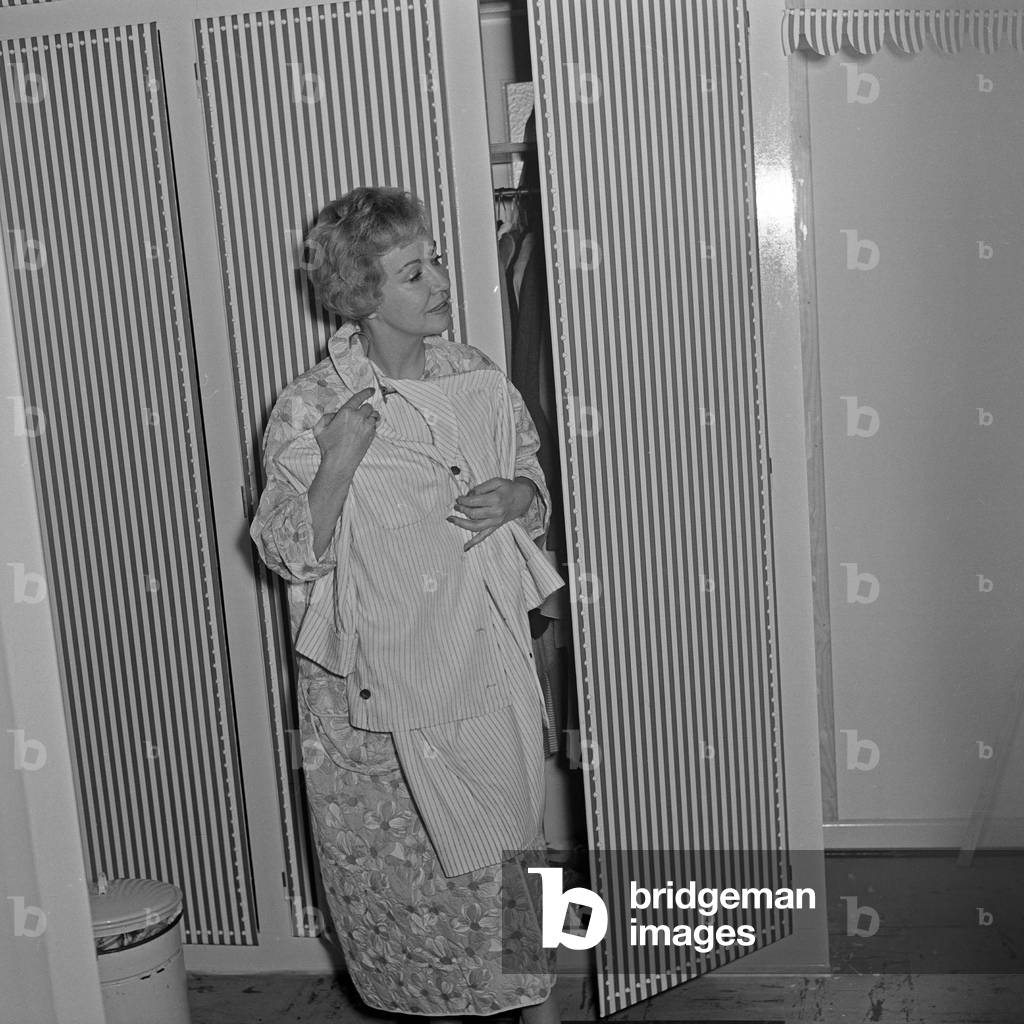 German TV presenter Angelika Feldmannchoosing her dresses, Germany 1950s