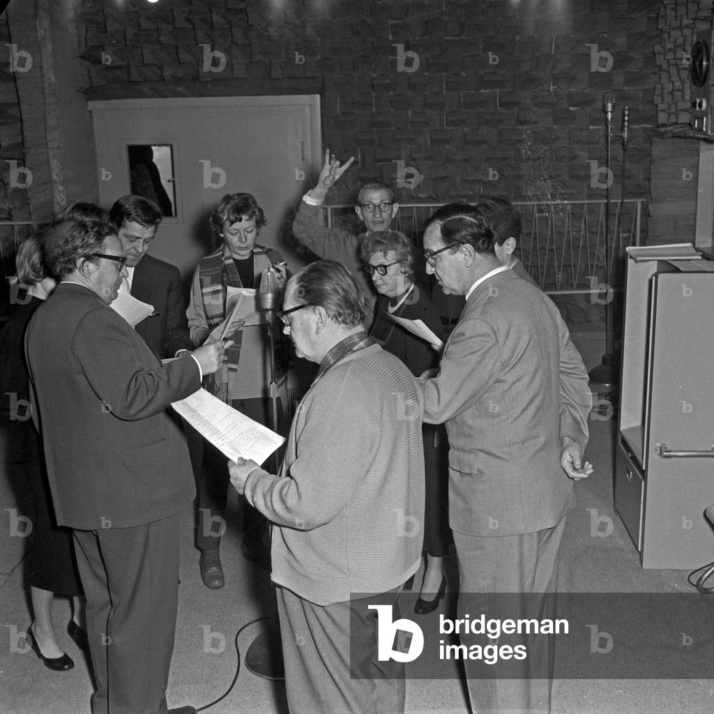 A group of speakers waiting for their parts at an audio play production of the NDR at Hamburg, Germany 1950s