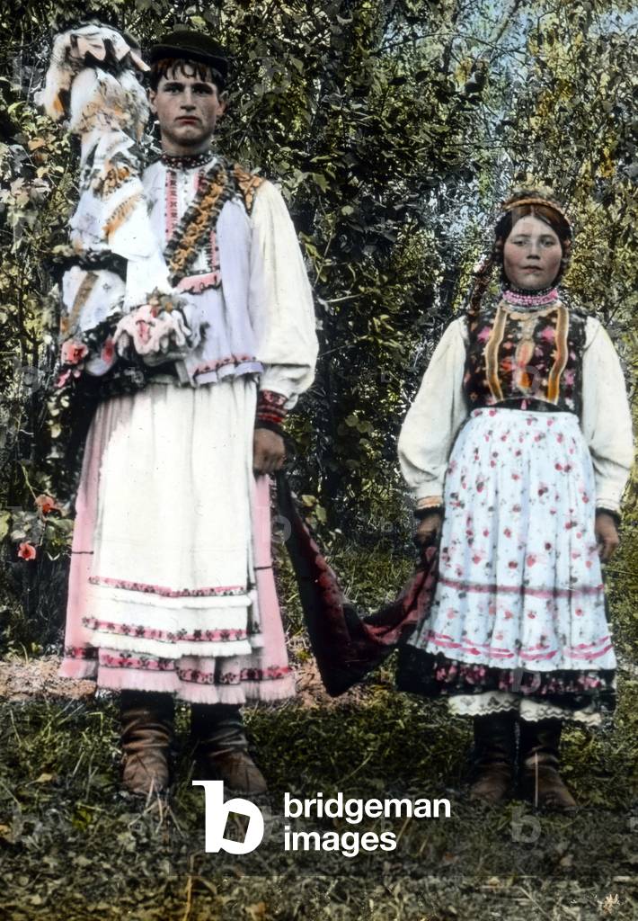 Romania, young bridal couple in traditional costume, image date: circa 1920. Carl Simon Archive