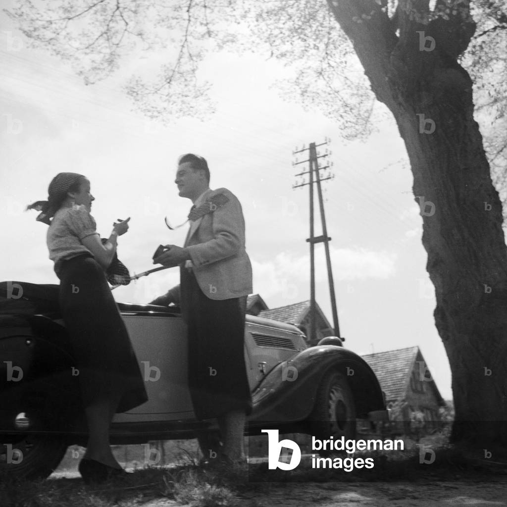 Women with their Ford model Eifel in Palatinate region, Germany 1930s (b/w photo)