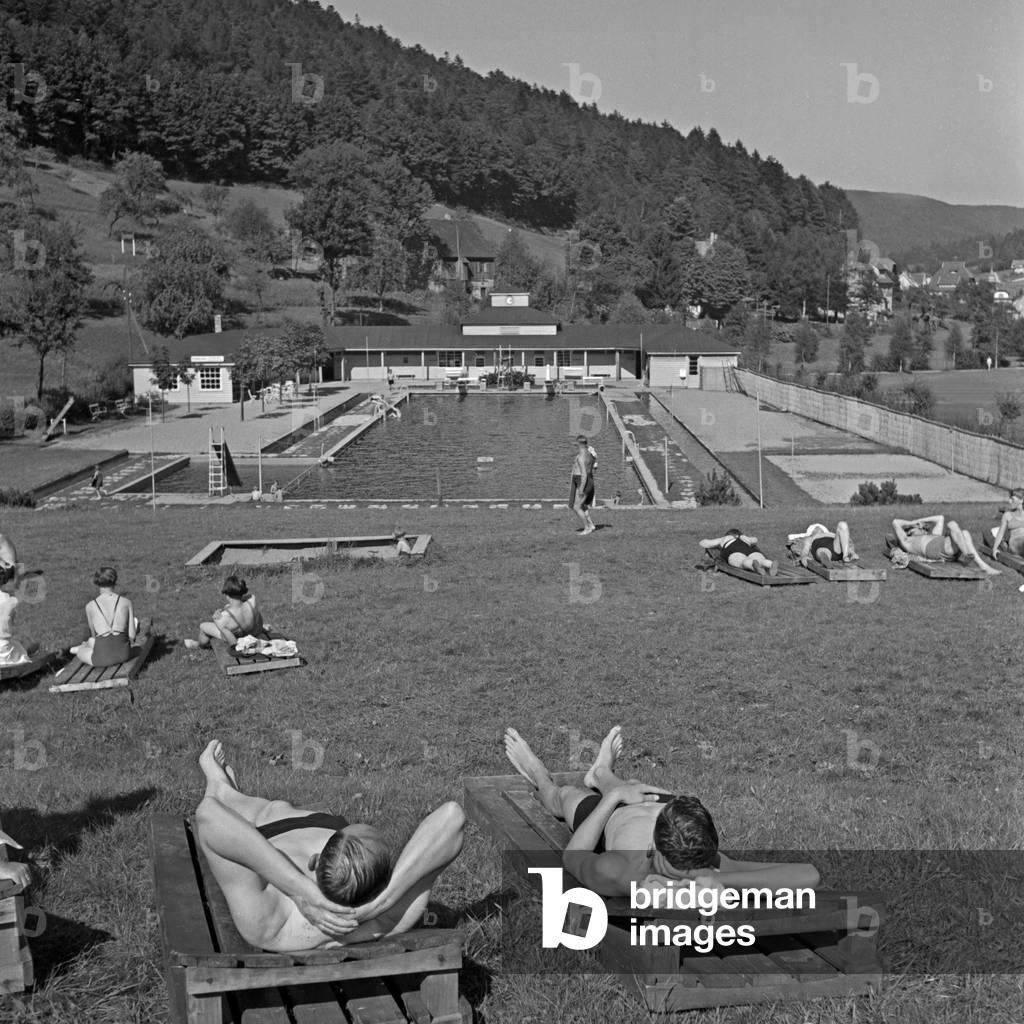People tanning at a bath at Wildbad in Black Forest, Germany 1930s (b/w photo)
