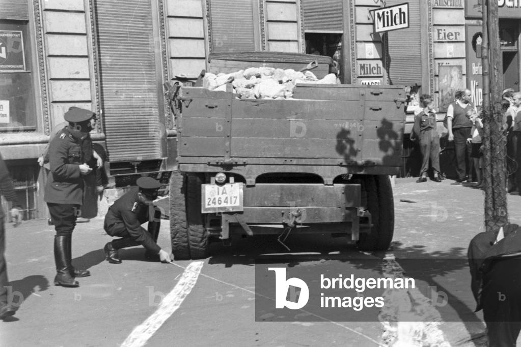 Policemen reconstructing a traffic accident, Germany 1930s (b/w photo)