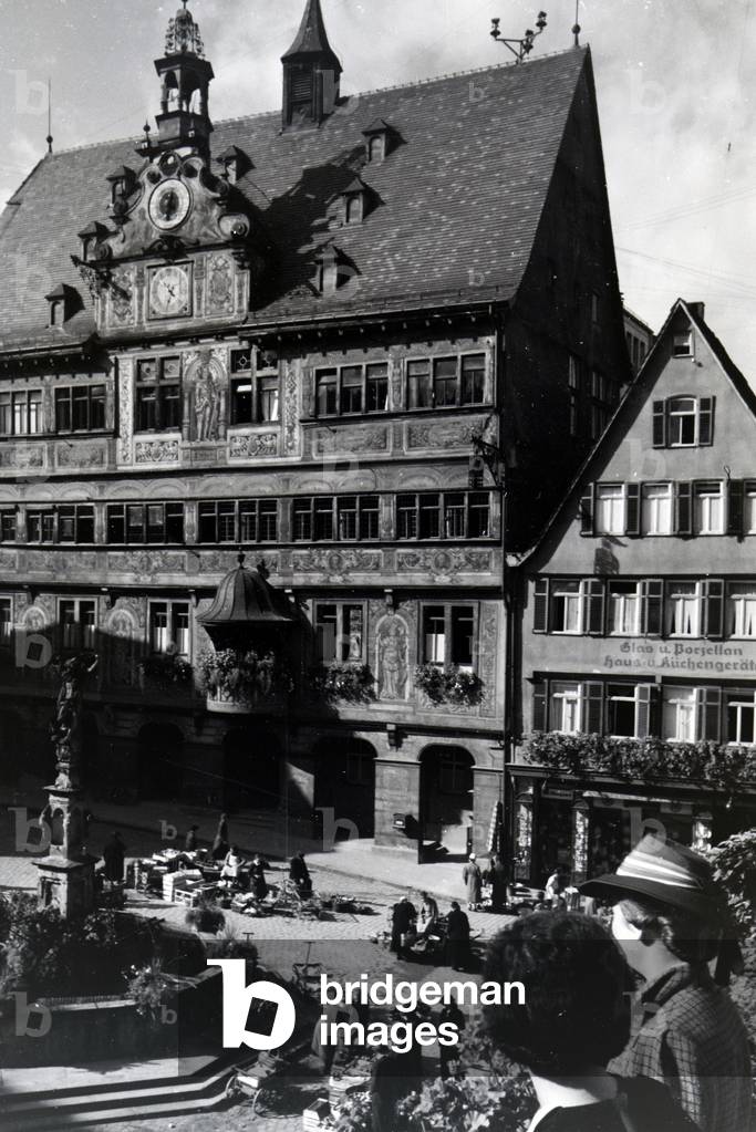 The city hall with the astronomical clock on the market square in Tübingen, Germany 1930s (b/w photo)