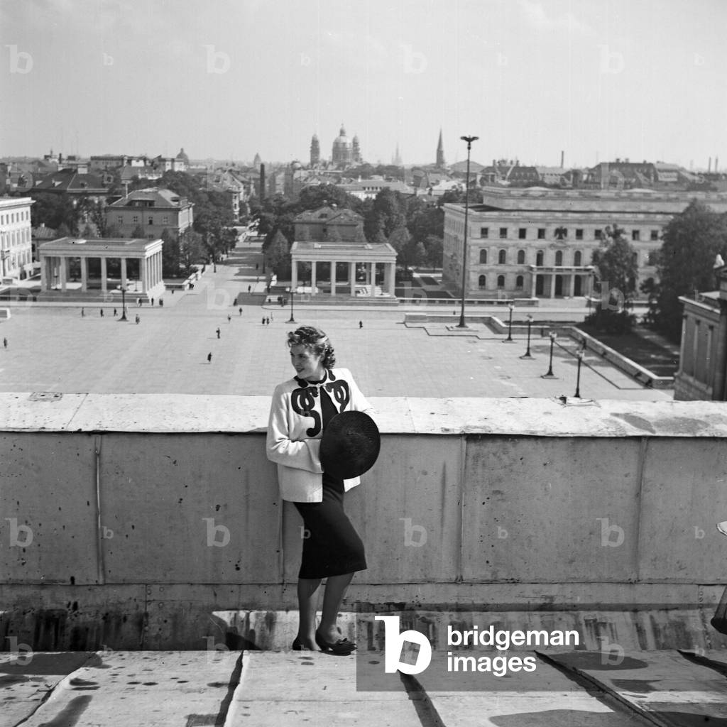 A woman leaning on a balustrade at Munich, Germany 1930s (b/w photo)