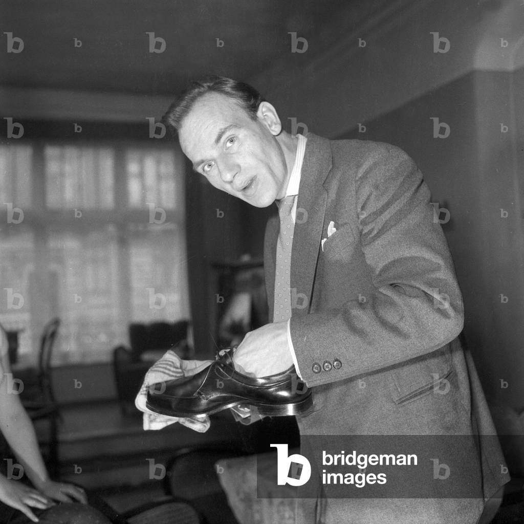 A man polishing the new cleaned shoes, Germany 1955