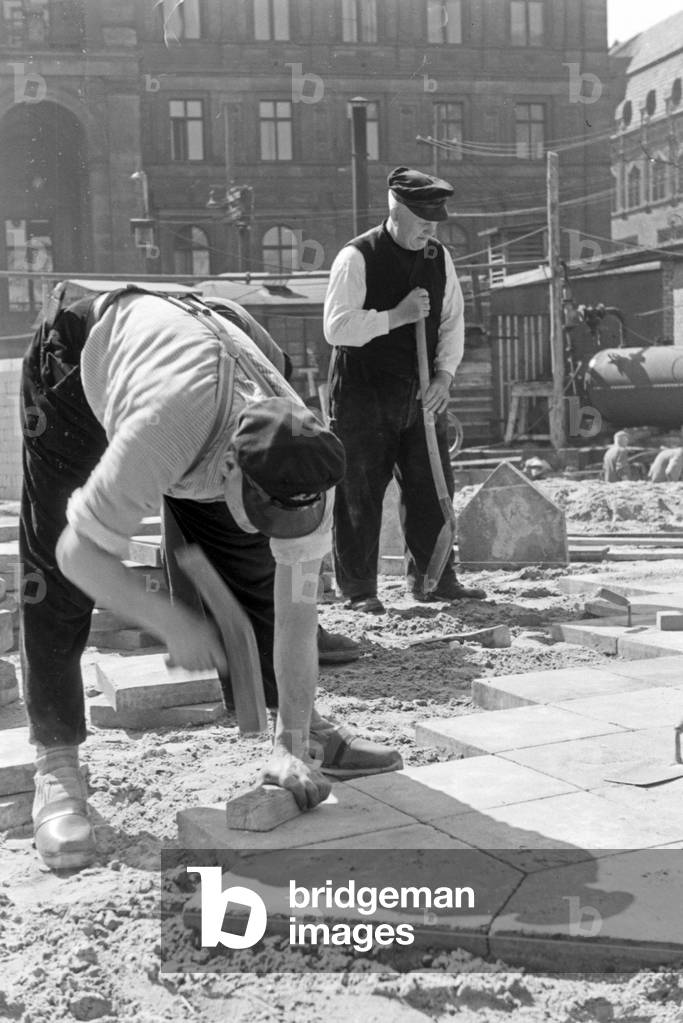 Construction workers at the last part of the North South connection of Berlin tram, Germany 1930s (b/w photo)