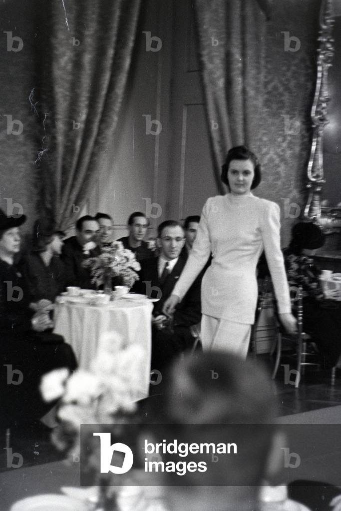 On the occasion of the Wiener Modewoche, a model is presenting a fancy dress in the house of fashion 