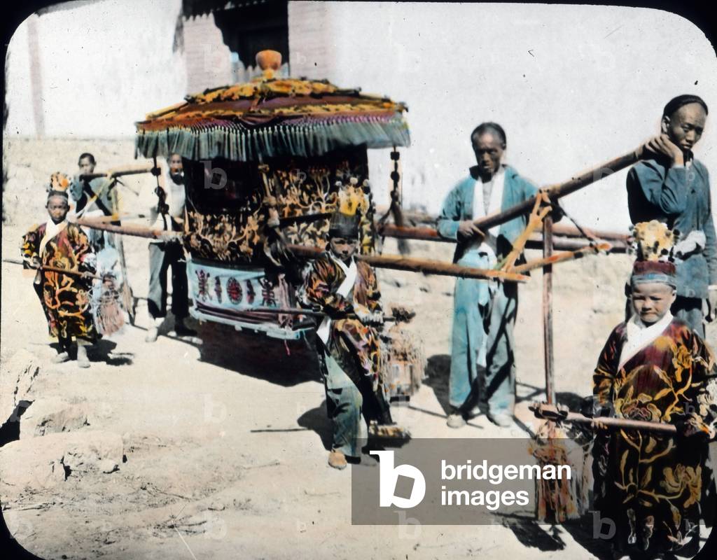 China, dignitary in palanquin, mage date: circa 1910, Carl Simon Archive