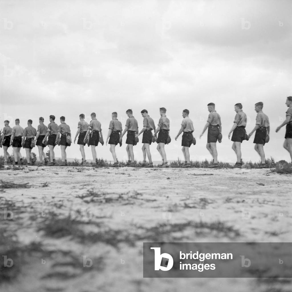 Hitler youths marching a row in Westfalia, Germany 1930s (b/w photo)