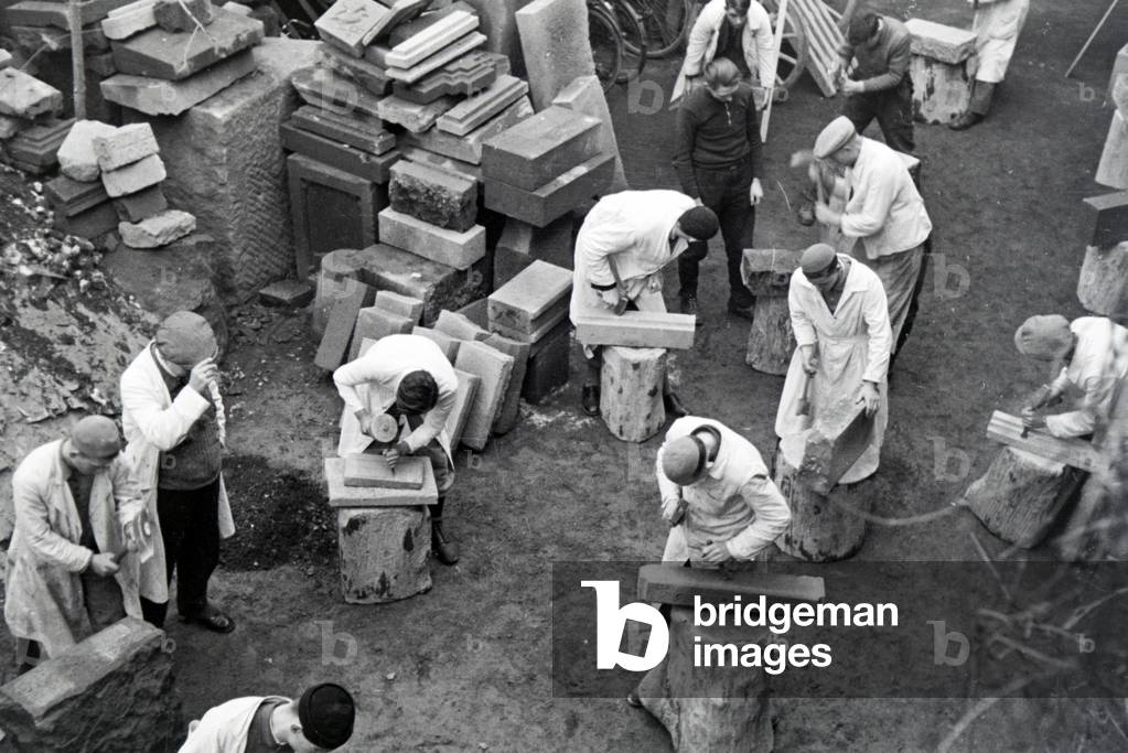 Trainees of a chiseller school at a tutorial, Germany 1937 (b/w photo)