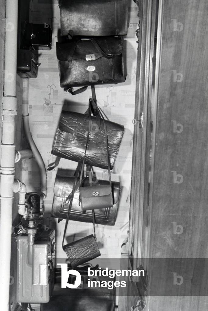 The schoolbags of a extended family, Germany 1930s (b/w photo)