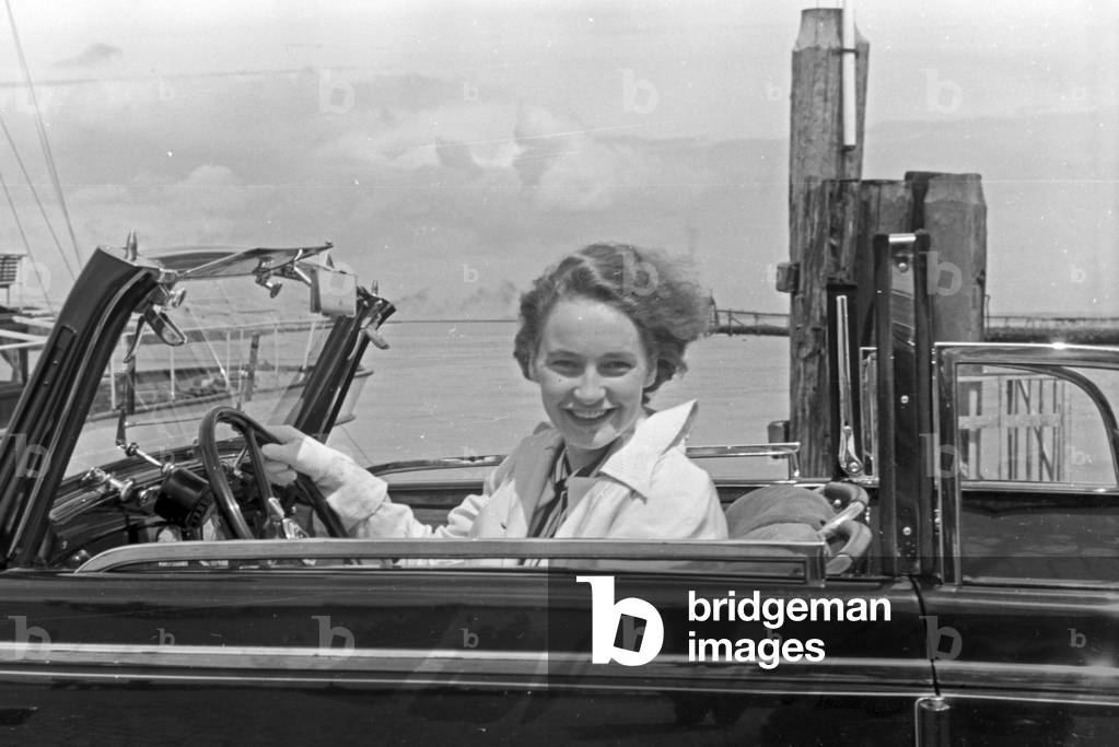 Woman in an Audi convertible at Norddeich, Germany 1930s (b/w photo)