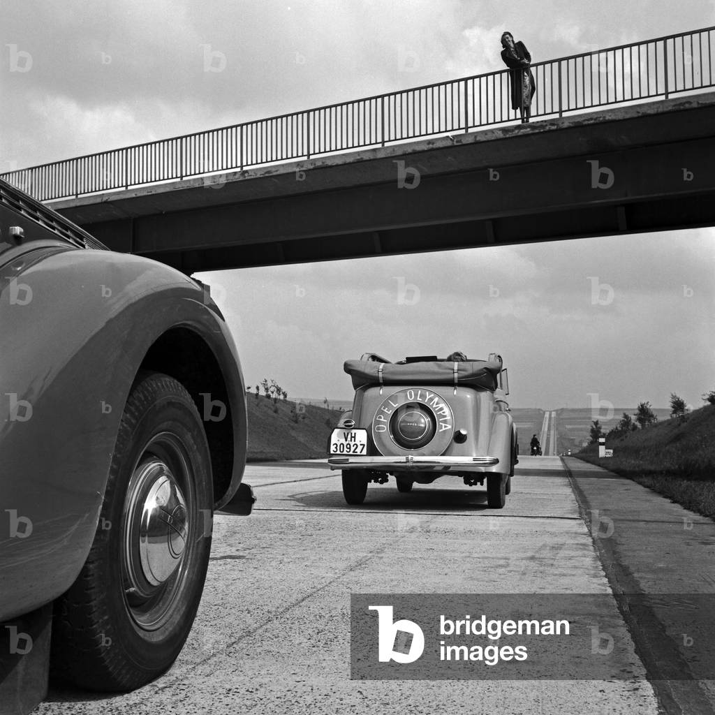 Opel Olympia convertible under a bridge on Reichsautobahn highway, Austria 1930s (b/w photo)