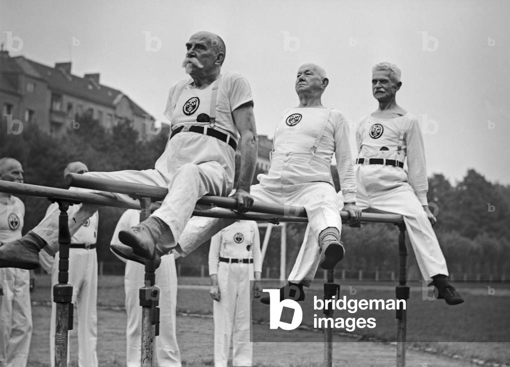 Members of a senior department of a gymnastic club exercising, Germany 1930s (b/w photo)