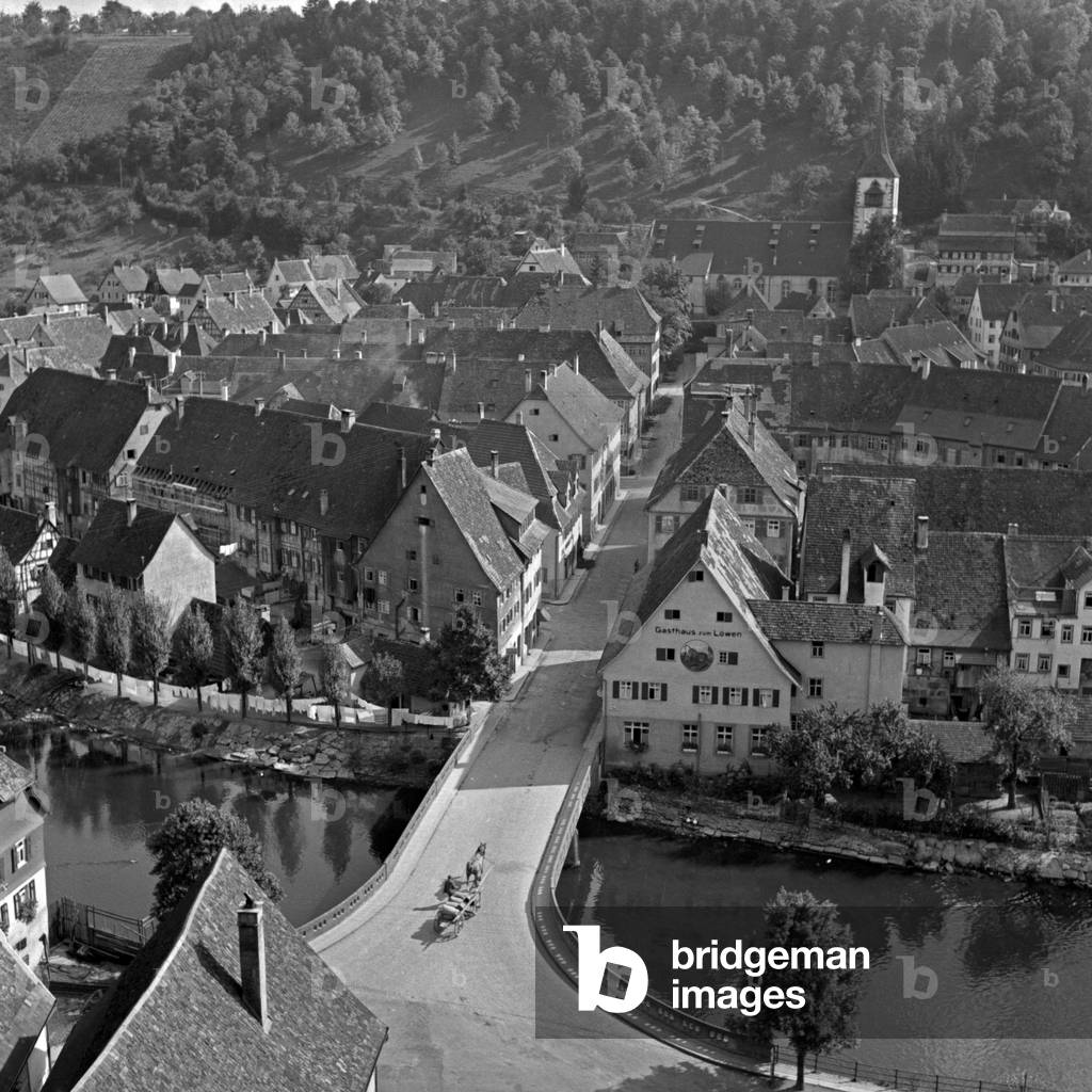 A carriage on the bridge over river Neckar at Sulz, Germany 1930s (b/w photo)