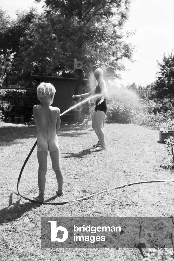 A family in their garden, Germany 1930s (b/w photo)