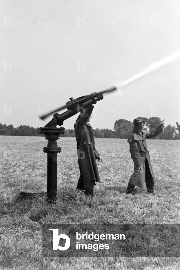 A sprinkler system in its agricultural use at a potato field, Germany 1930s (b/w photo)