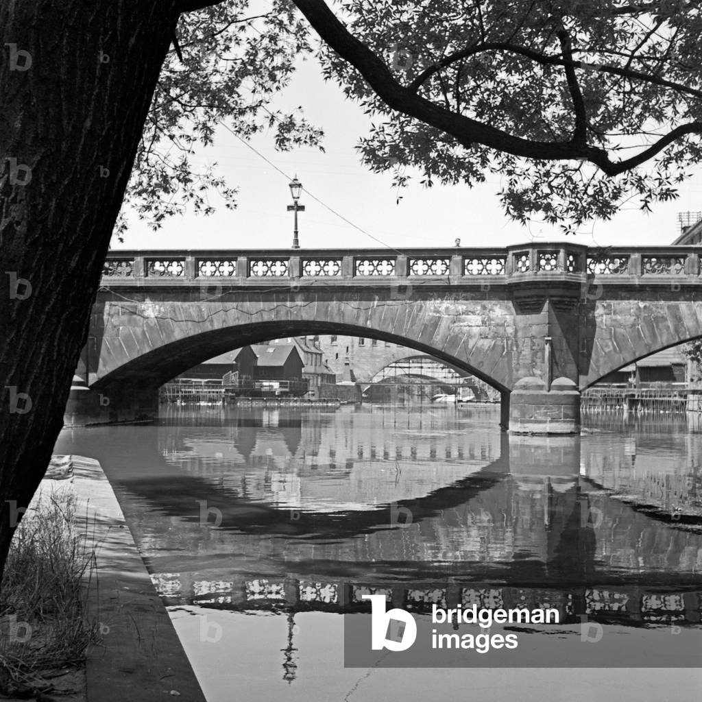 The Maxbruecke bridge over the river Pegnitz in the old city of Nuremberg, Germany 1930s (b/w photo)