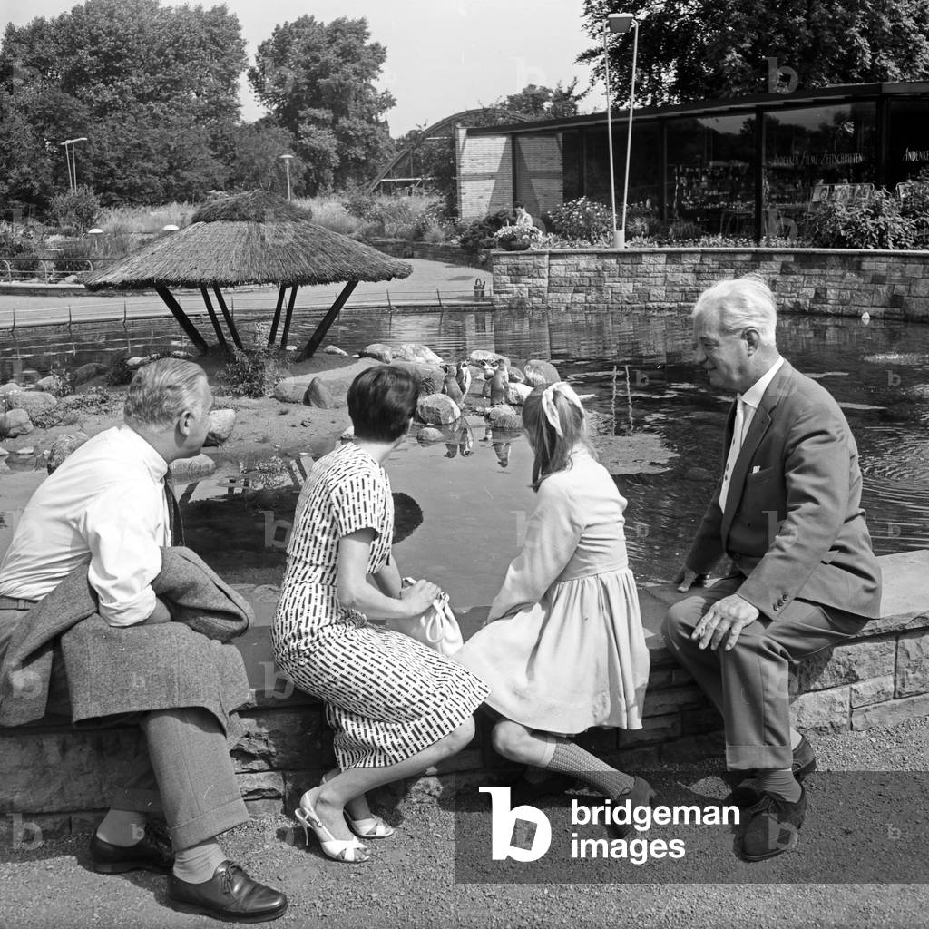 German television announcer Irene Koss with a child from Berlin at Planten un Blomen public gardens in Hamburg, Germany 1950s