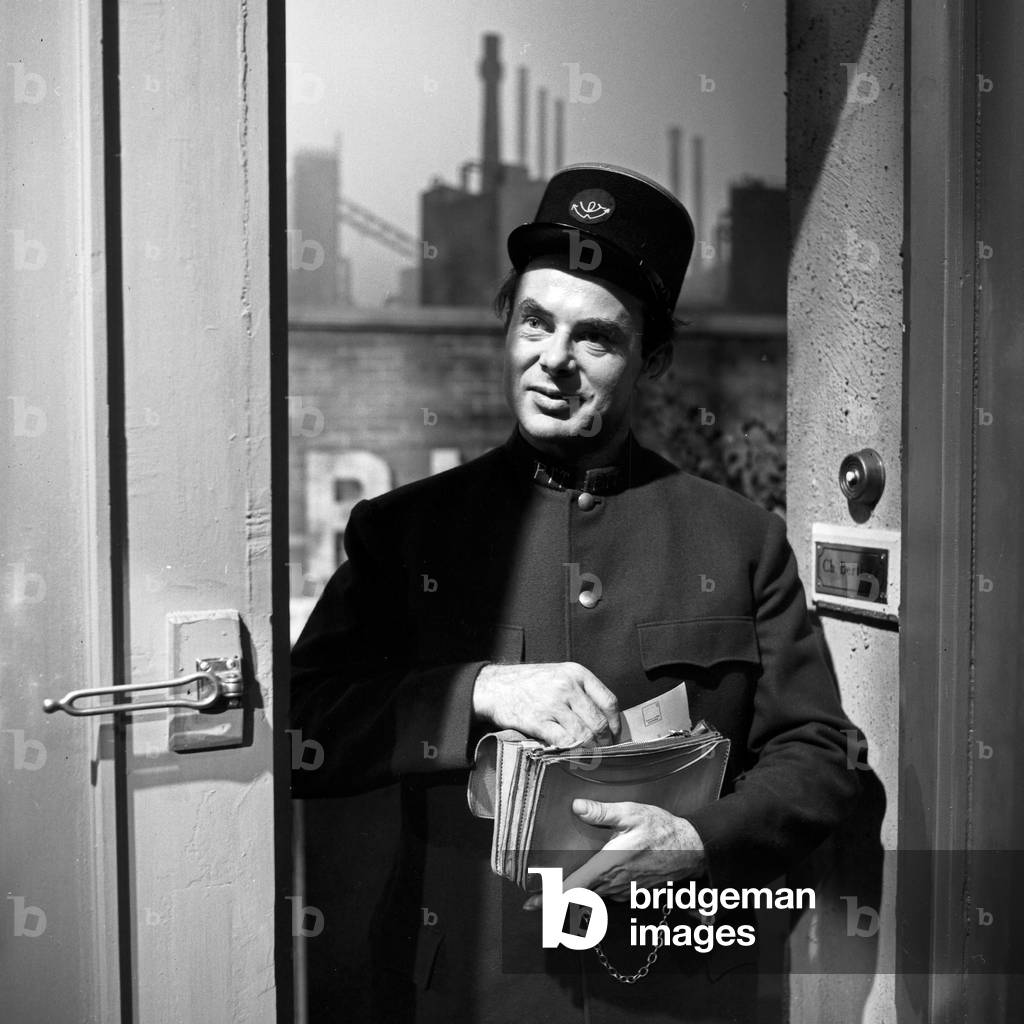 A postman delivering money orders, Germany 1960s