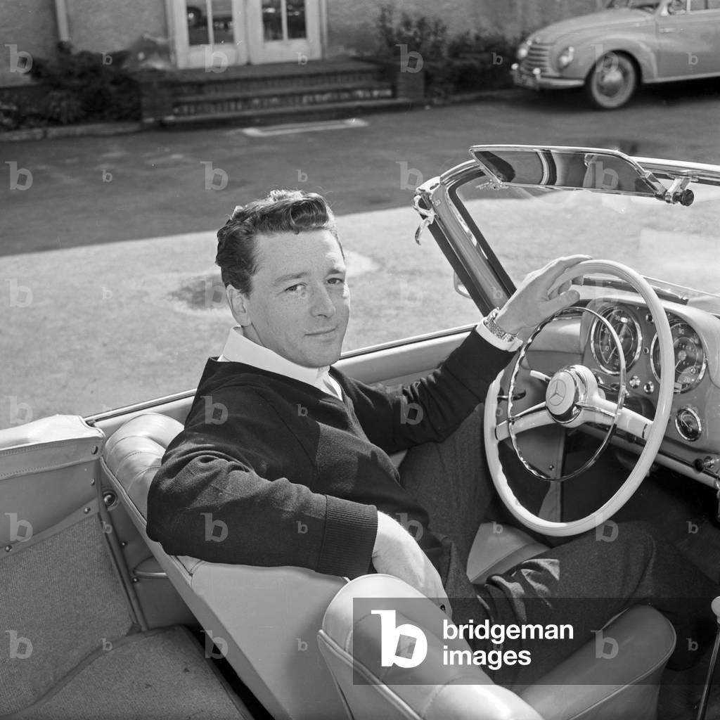 Irish singer Johnny Dane in his Mercedes Benz 190 SL convertible at Hamburg, Germany 1950s