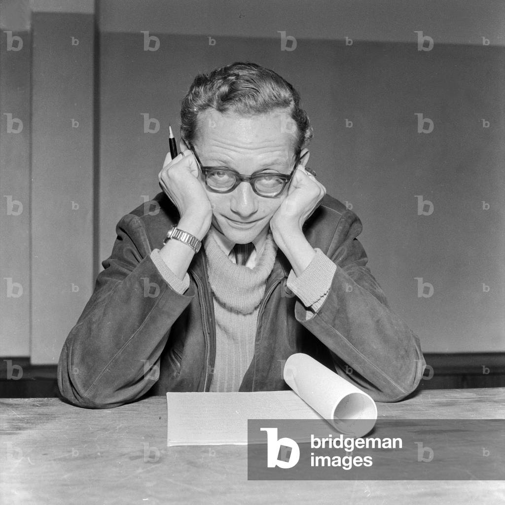 A man reading a manuscript at German radio and TV station, Hamburg 1955
