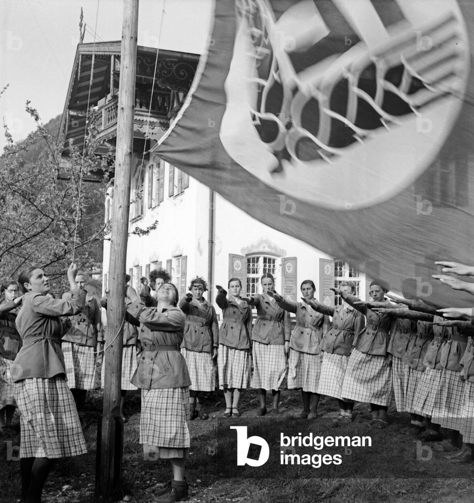 Morning muster and flying the flag at Hohenaschau at Frauenarbeitsdienst female workforce, Germany 1930s (b/w photo)