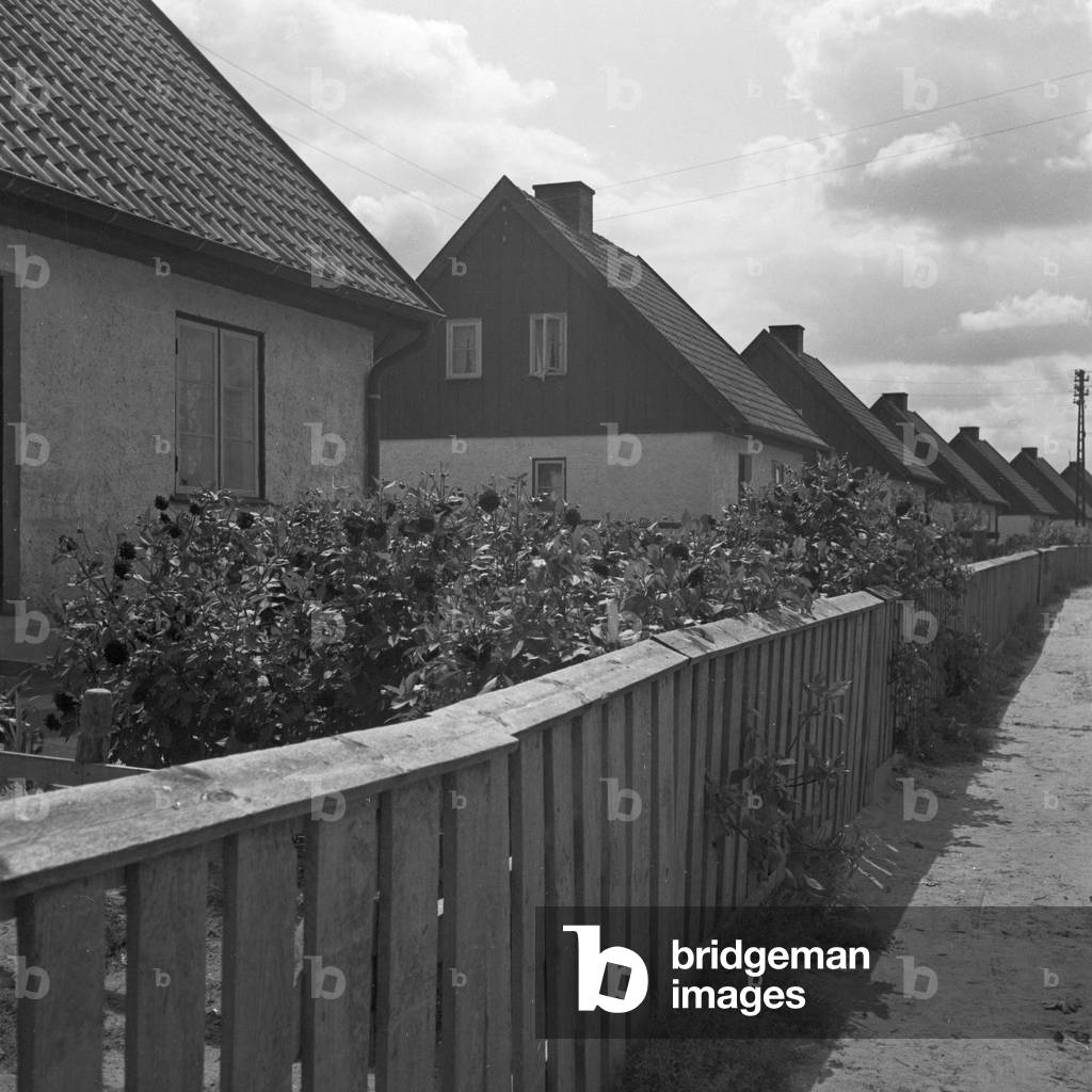 Serial houses at Johannisburger Strasse street at Allenstein in East Prussia, Germany 1930s (b/w photo)