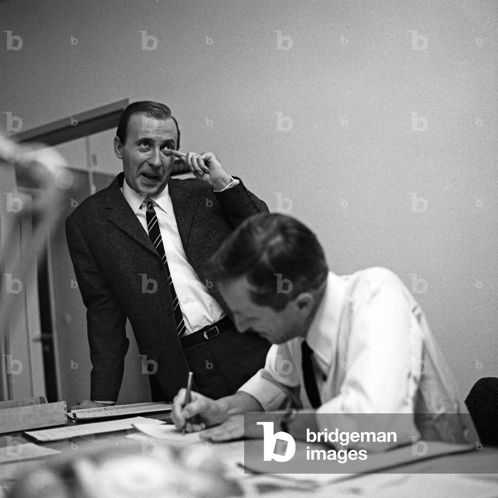 German news presenter Karl Heinz Koepcke (left) at editor's office of news show 