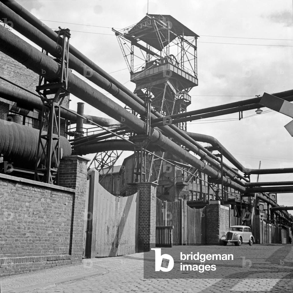 Headgear of the Krupp cast steel works at Essen, Germany 1930s (b/w photo)