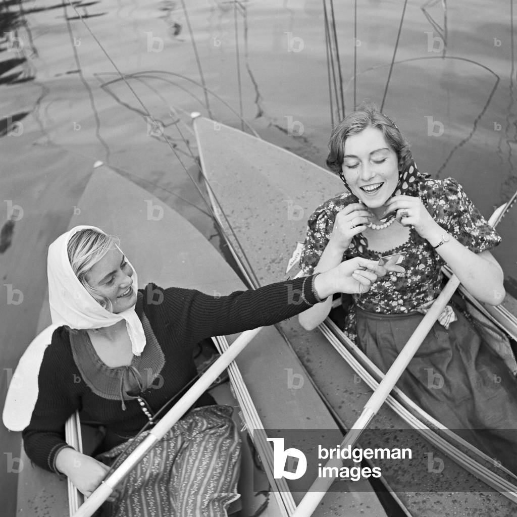 Two young women at a boardwalk on the shore of a lake in the Wachau area, Germany 1930s (b/w photo)