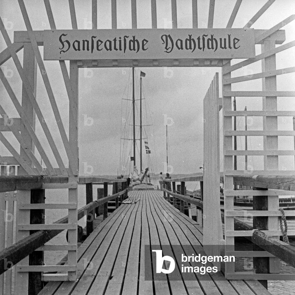Entrance to the quay with the boats of the Hanseatic yachting school, Germany 1950s