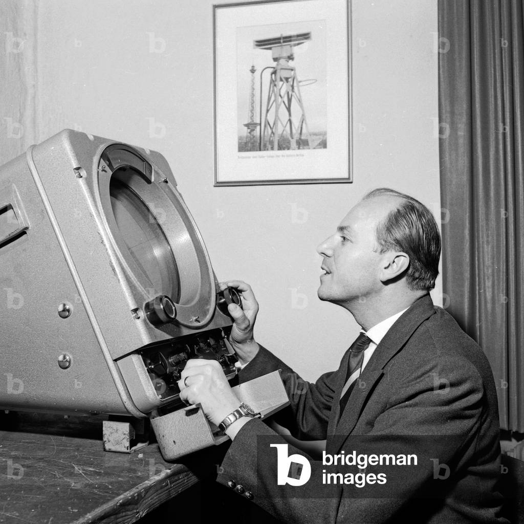 Journalist and editor Holger Hofmann explaining radar equipment, Germany 1960s
