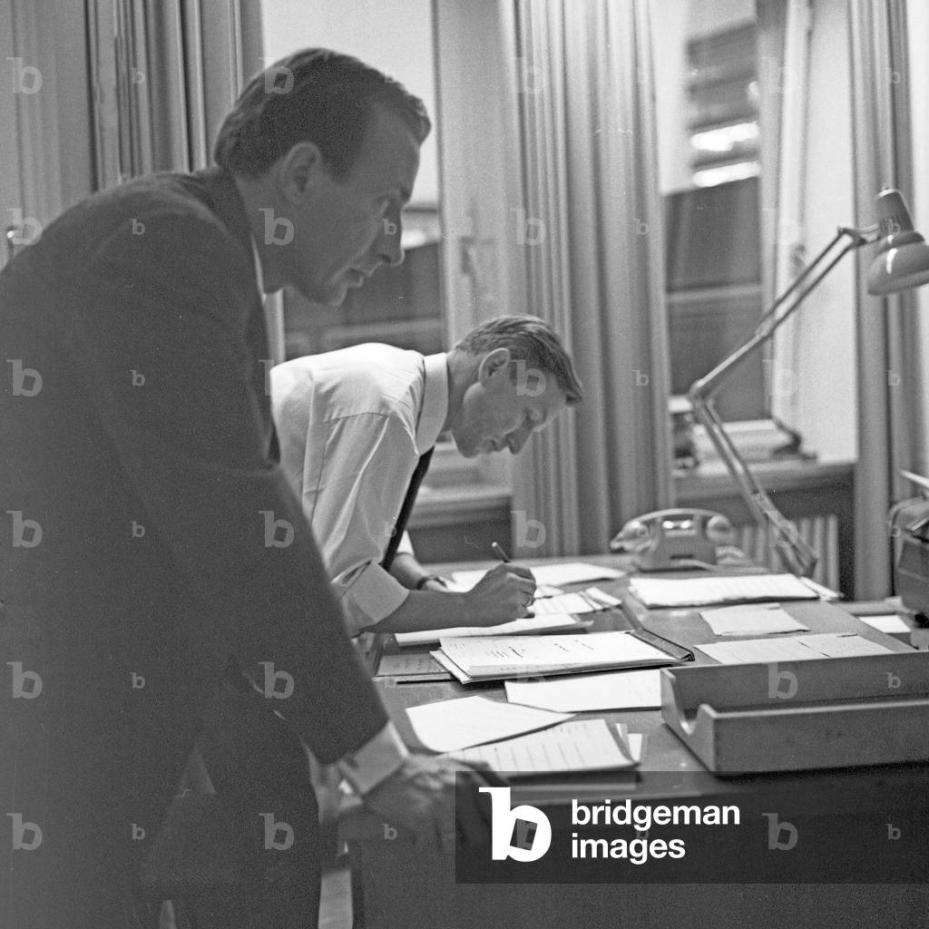 German news presenter Karl Heinz Koepcke (left) at editor's office of news show 