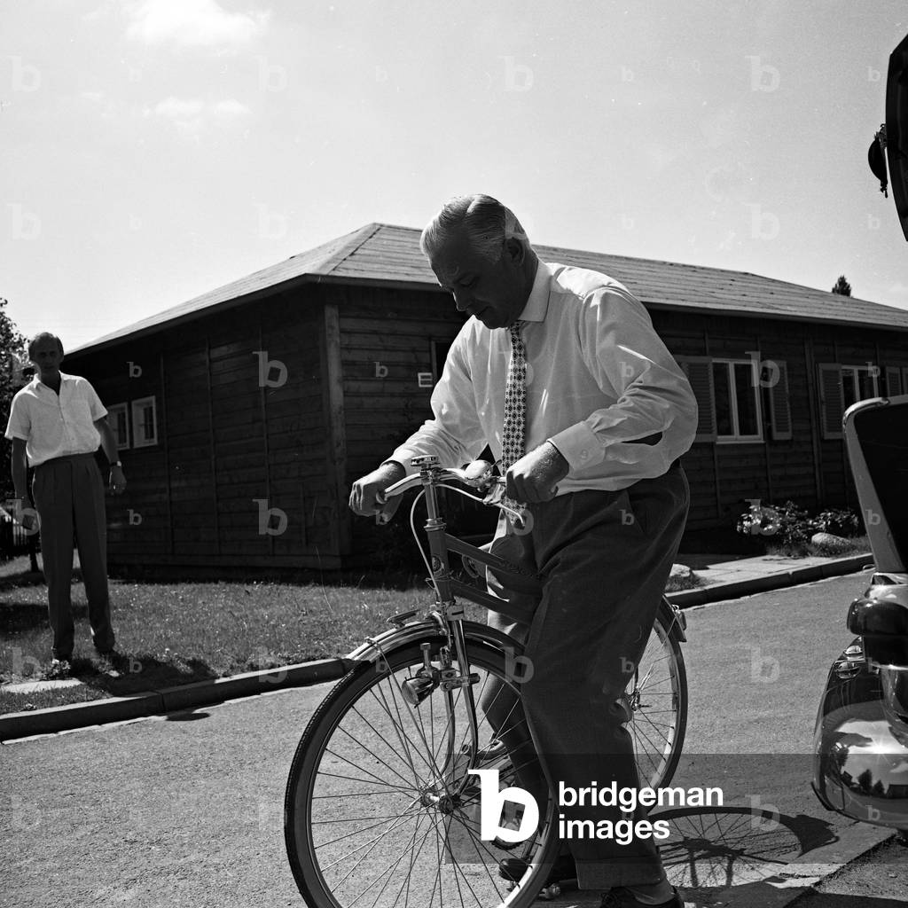 German manager and founder of TV lottery, Jochen Richert, relaxing while riding his bicycle, Germany 1960s