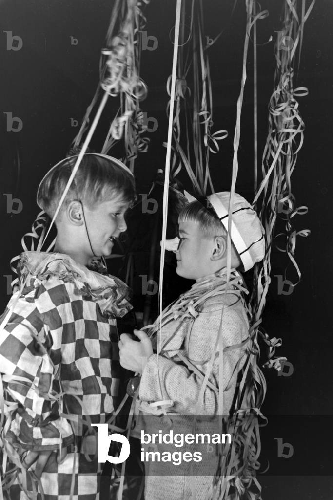 Two little boys dressed for a carnival, Germany 1930s (b/w photo)