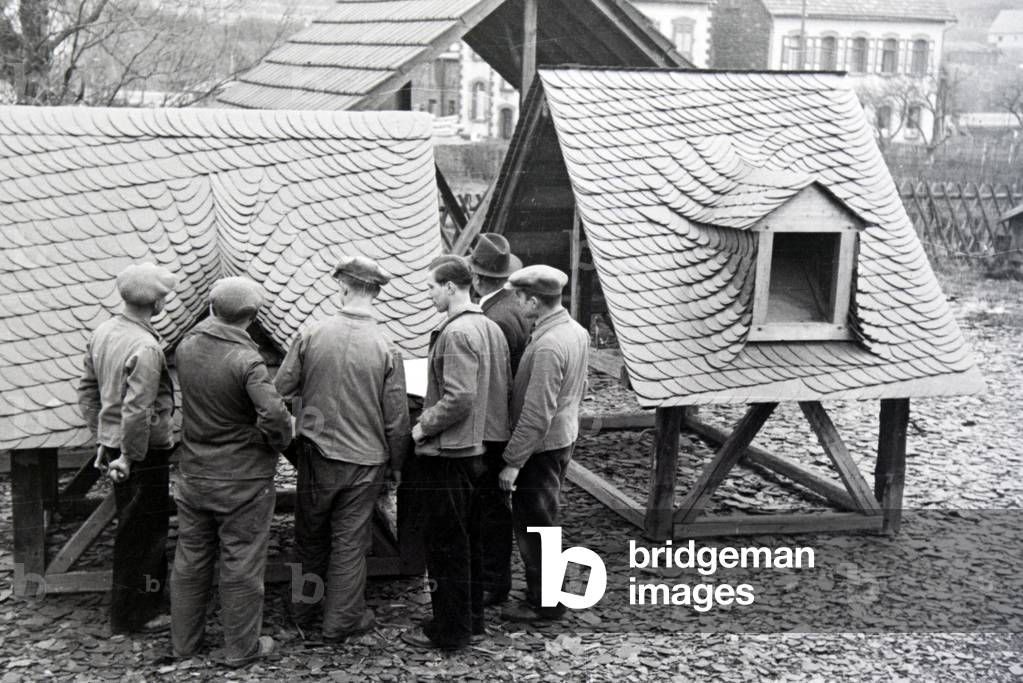 Trainees of a roofer school at a tutorial, Germany 1937 (b/w photo)