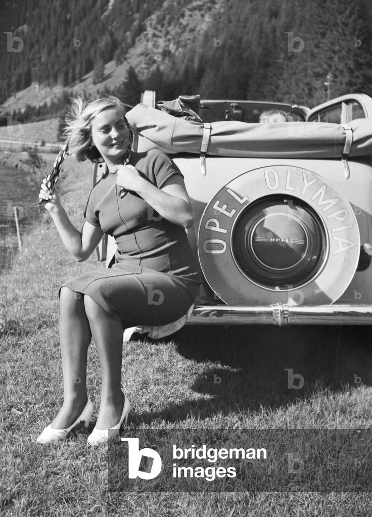 On the road with an Opel model Olympia at the Wachau area in Austria, Germany 1930s (b/w photo)