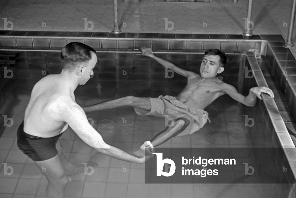 A patient in a therapeutic bath, Germany 1930s (b/w photo)