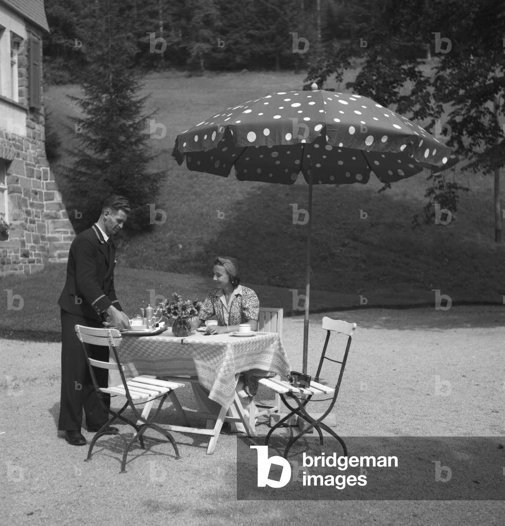 German actress Evelyn von Schoening at the spa resort Villa Sommerberg at Bad Rippoldsau in the Black Forest, Germany 1930s (b/w photo)