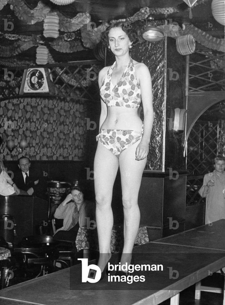 A young woman on the catwalk of a nightclub at Hamburg Reeperbahn, 1950s