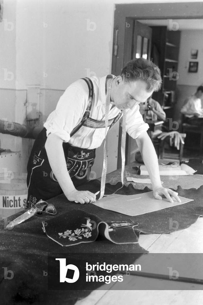 A tailor from Bad Tölz making Lederhosen, Germany 1930s (b/w photo)