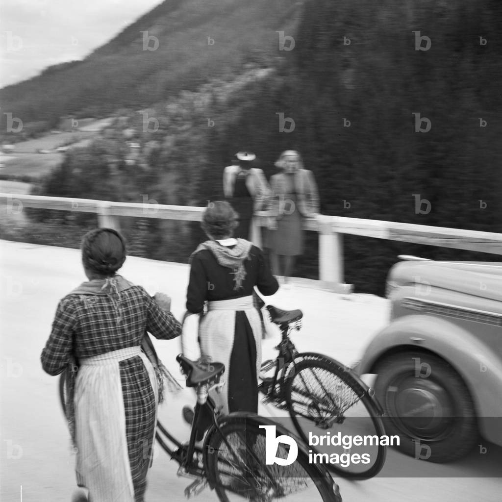 On the road with an Opel model Olympia at the Wachau area in Austria, Germany 1930s (b/w photo)