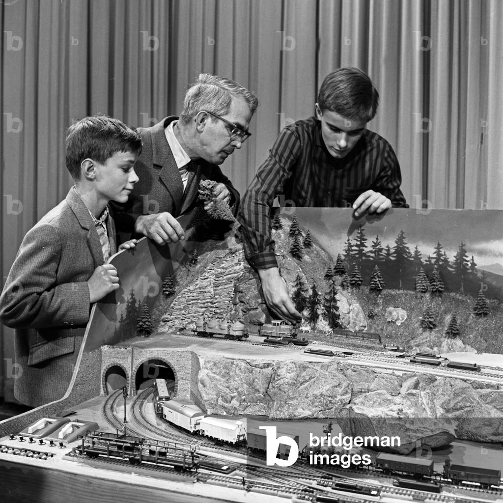 Presenter Friedrich Karl Ries showing model trains at his show 