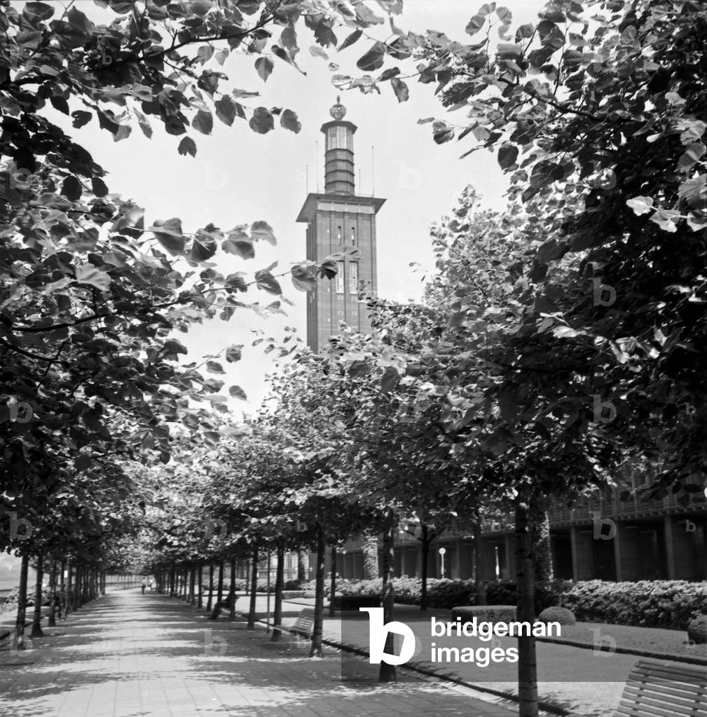 Shore of river Rhine with Cologne fair buildings and tower, 1930s (b/w photo)