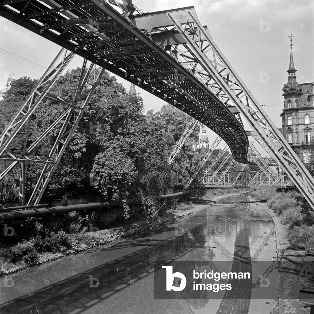 Wuppertal Suspension Railway refelcting in the river Wupper, Germany 1930s (b/w photo)