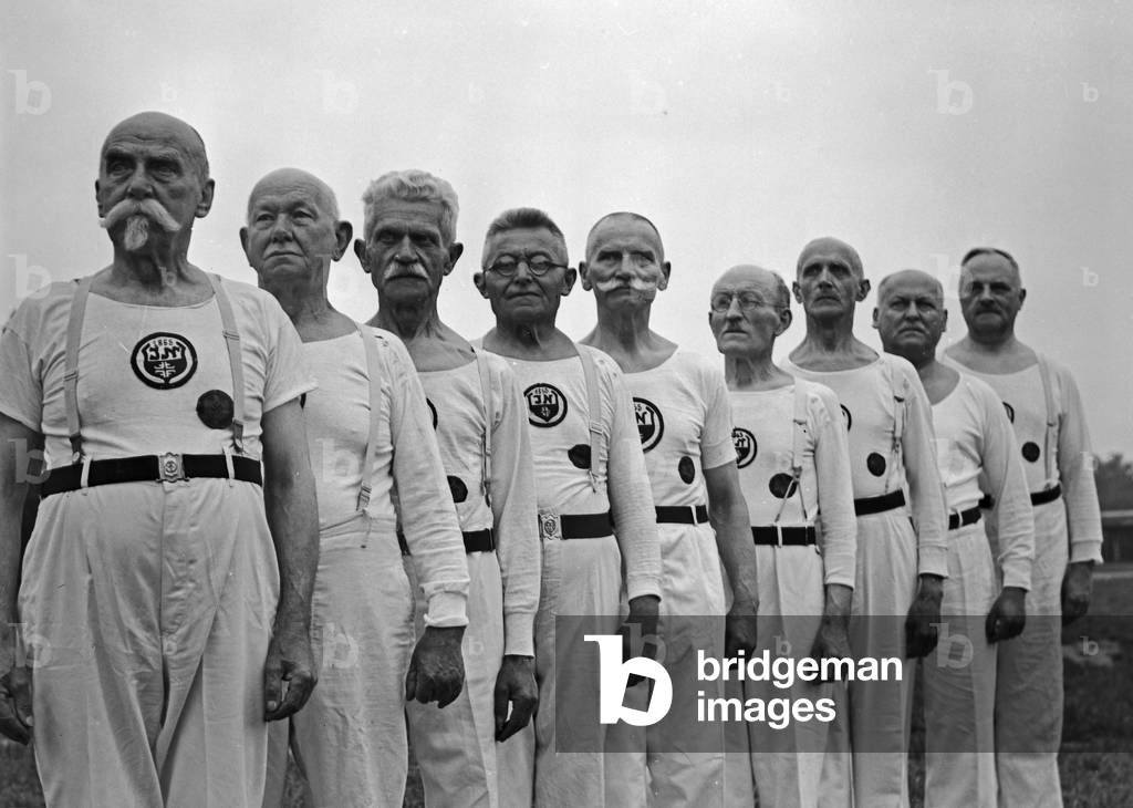 Members of a senior department of a gymnastic club exercising, Germany 1930s (b/w photo)