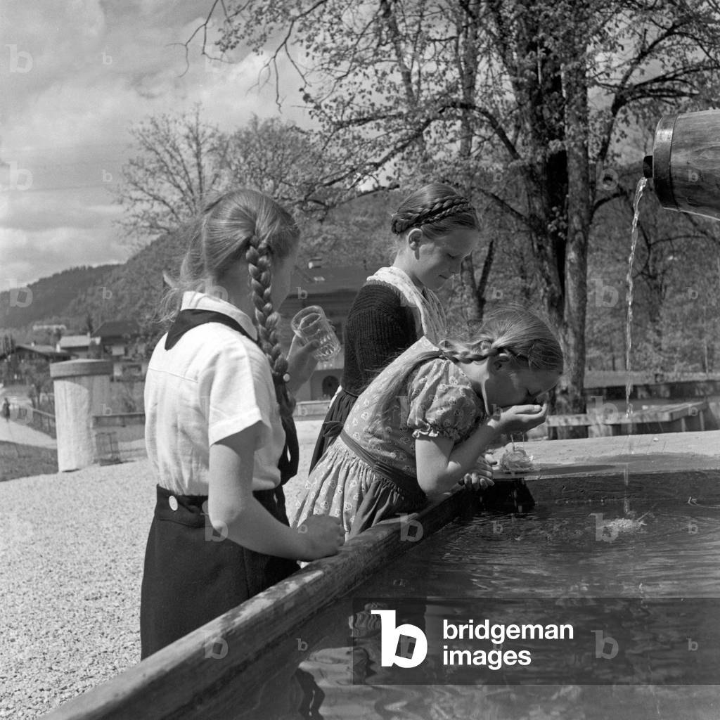 BdM girls drinking from a dwell near the Adolf Hitler youth hostel at Berchtesgaden, Germany 1930s