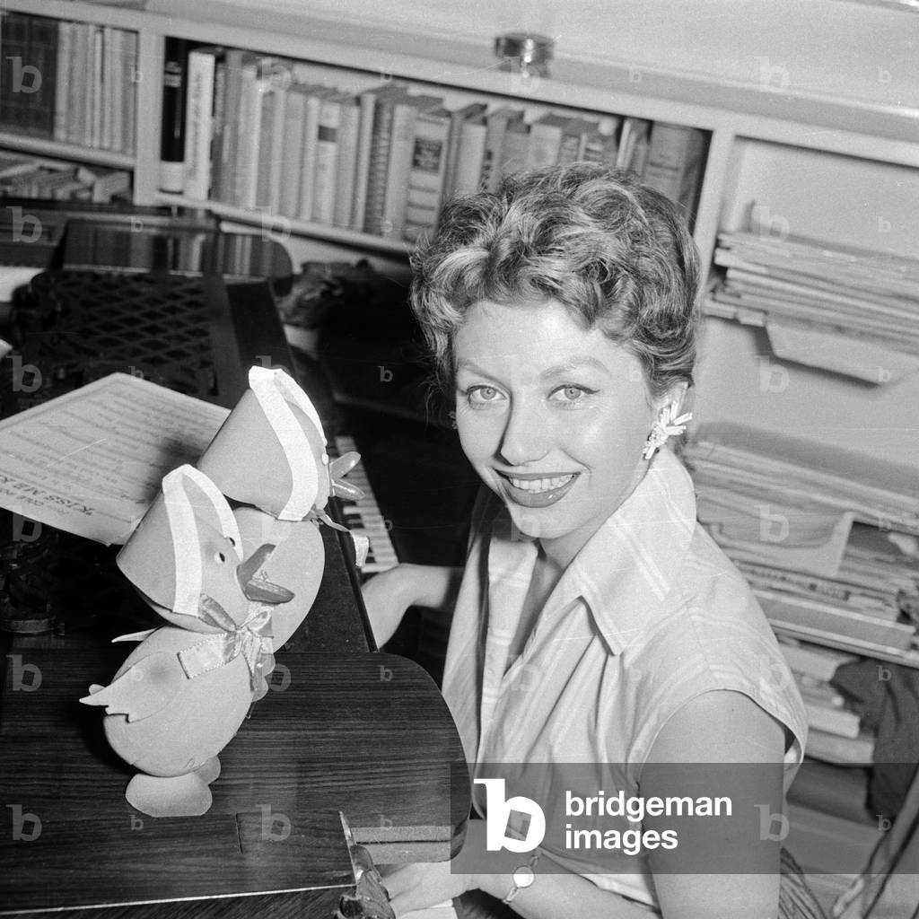 German actress Gisela Griffel with two easter chick dolls, Germany 1950s