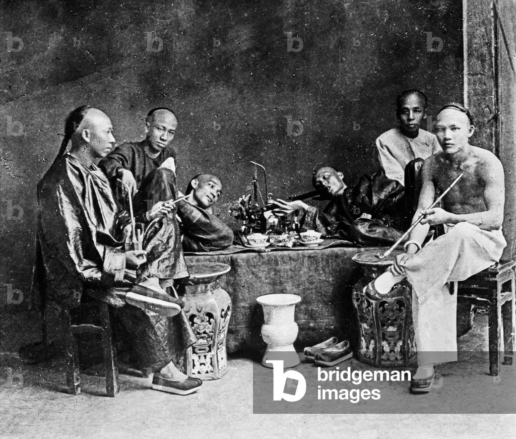 Chinese smoking in an opium den, China 1910s